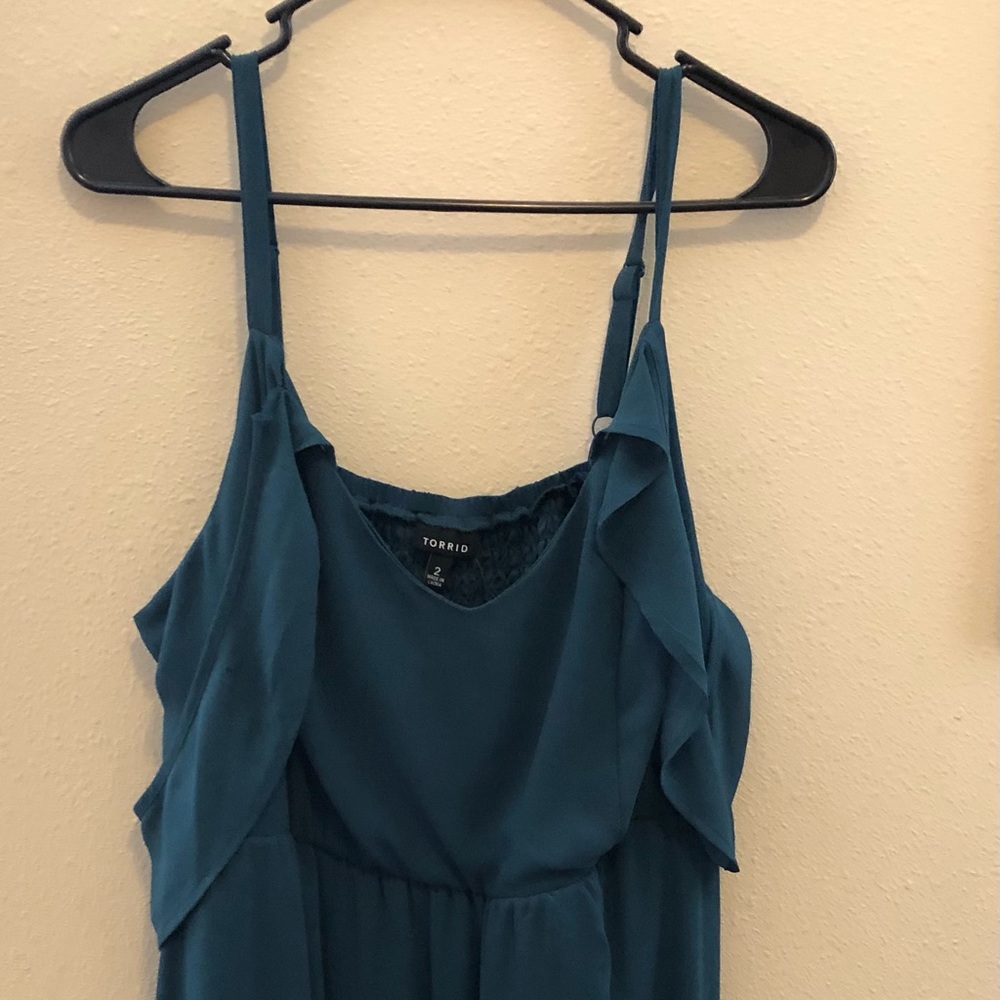 Cold shoulder dress. Dark turquoise color. Does have a small rip in arm.